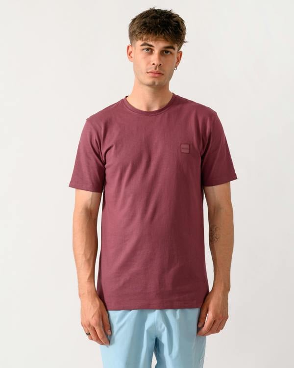 model wearing a BOSS Orange Tales Mens Cotton-Jersey T-shirt With Logo Patch in Medium Red 618