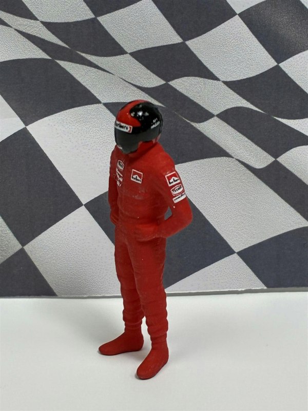 a toy figure in a red uniform
