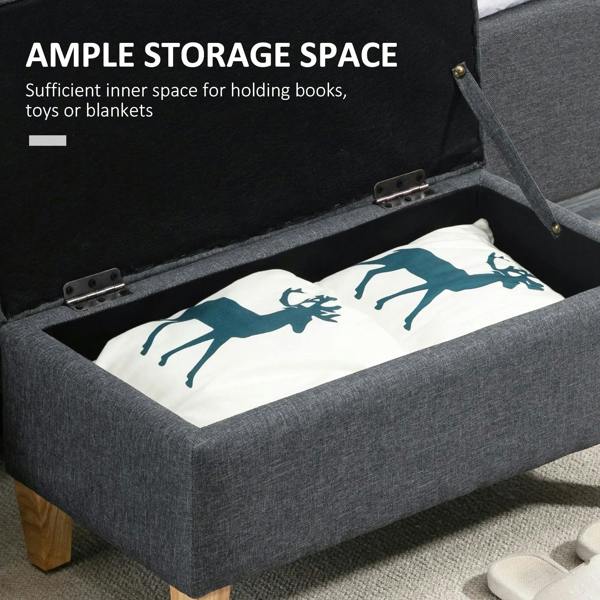 Dark grey storage ottoman with open lid and inner compartment