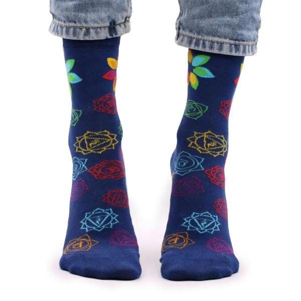 Navy bamboo socks with multicolor chakra flower and geometric stripe accents on foot