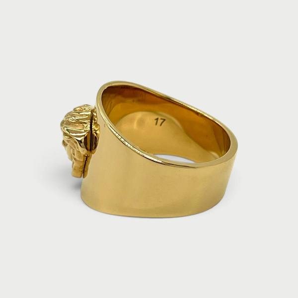 Supplied Fashion gold Medusa head statement ring with a polished finish and engraved size 17 on the inner band
