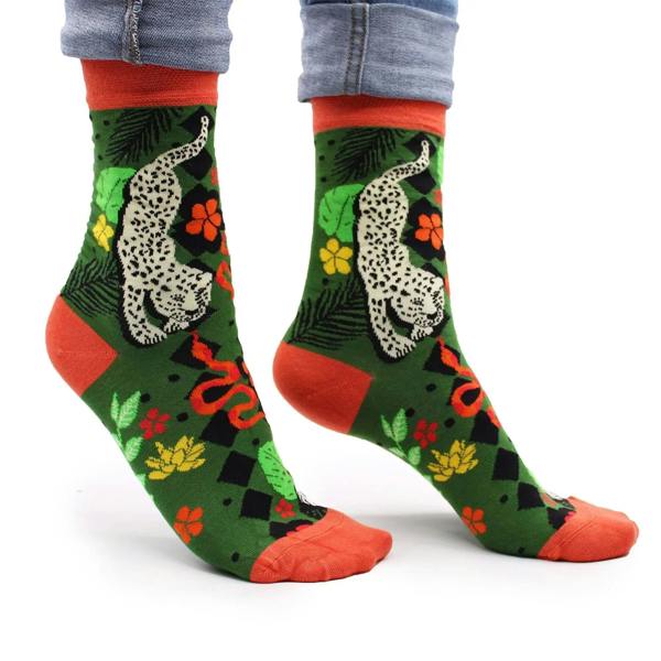 Jungle print bamboo socks with green base, red toes, and white leopard graphic