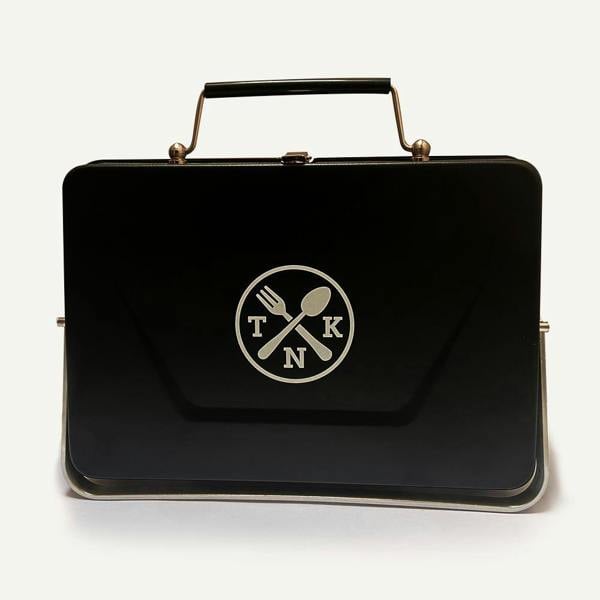Sleek matte black Portable Notebook BBQ folded flat against a white background.
