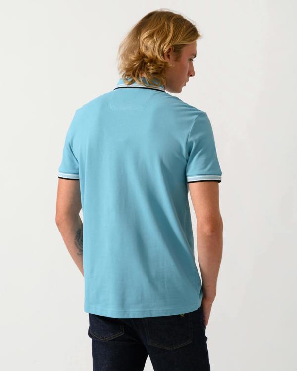 studio photograph of the back of a model wearing a BOSS Green Paddy Mens Cotton-Piqué Polo Shirt with Contrast Logo in Open Blue 486
