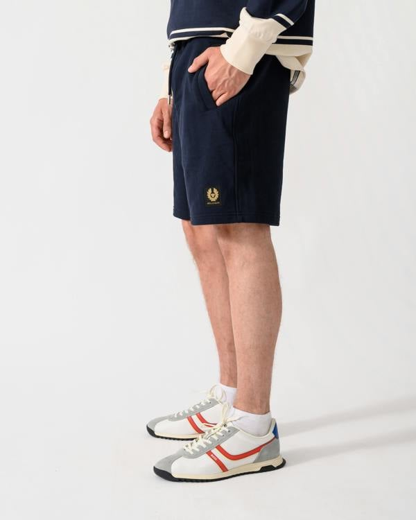 shot of model wearing a pair of Belstaff Mens Logo Sweatshorts in Dark Ink
