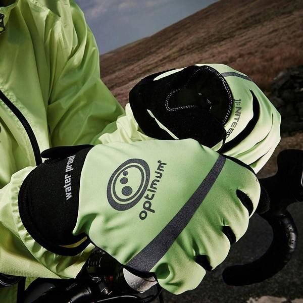 Cyclist wearing fluorescent yellow Optimum NiteBrite gloves gripping handlebars on a hillside road - Optimum