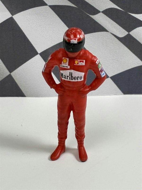 a toy figure of a man wearing a helmet