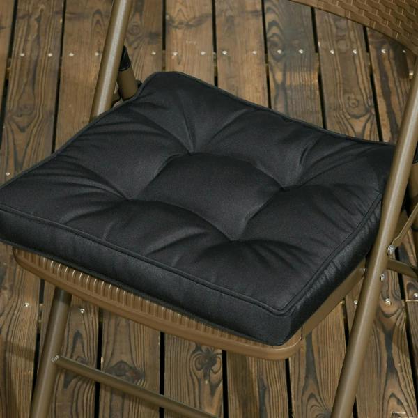 Black tufted square seat cushion with ties on a chair seat