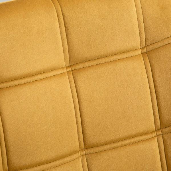 Yellow velvet accent chair back with quilted square padding and stitched seams