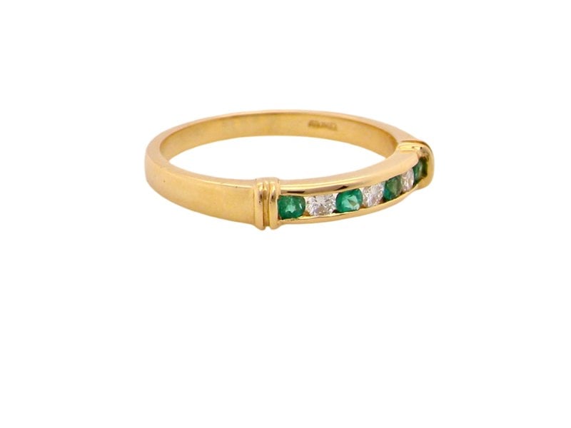 Vintage Tom An 18 carat gold Emerald and Diamond Eternity ring