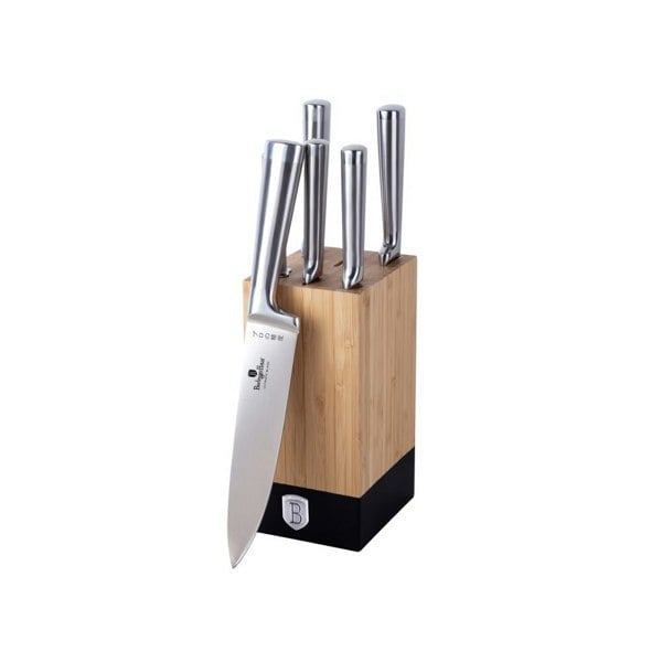 A set of six stainless steel knives with black handles, arranged in a stylish bamboo stand, including a chef knife, slicer knife, bread knife, utility knife, paring knife, and a sharpener.