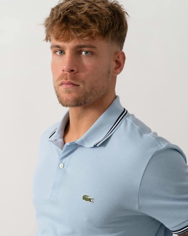Model wearing Lacoste Contrast Collar Pique Mens Regular Fit Polo Shirt in Chambray - Detail