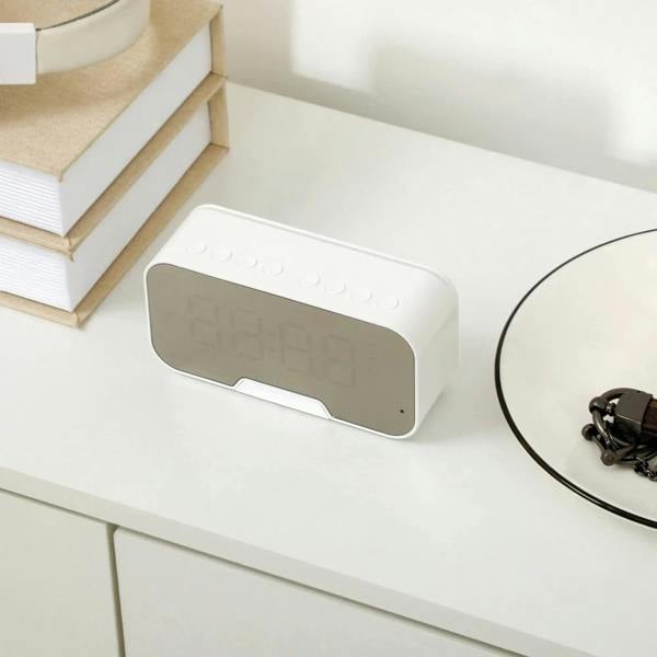 White shoe cabinet anti-tipping connector plate on top edge, close-up