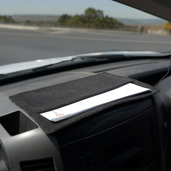 Anthracite grey storage pouch resting on a car dashboard, featuring a soft texture and sleek design for organizing items