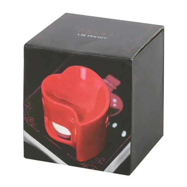 Red heart-shaped oil burner inside black gift box with printed logo