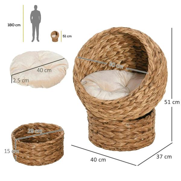 Rattan wicker cat bed with cushion, cylindrical base and domed round opening; size shown