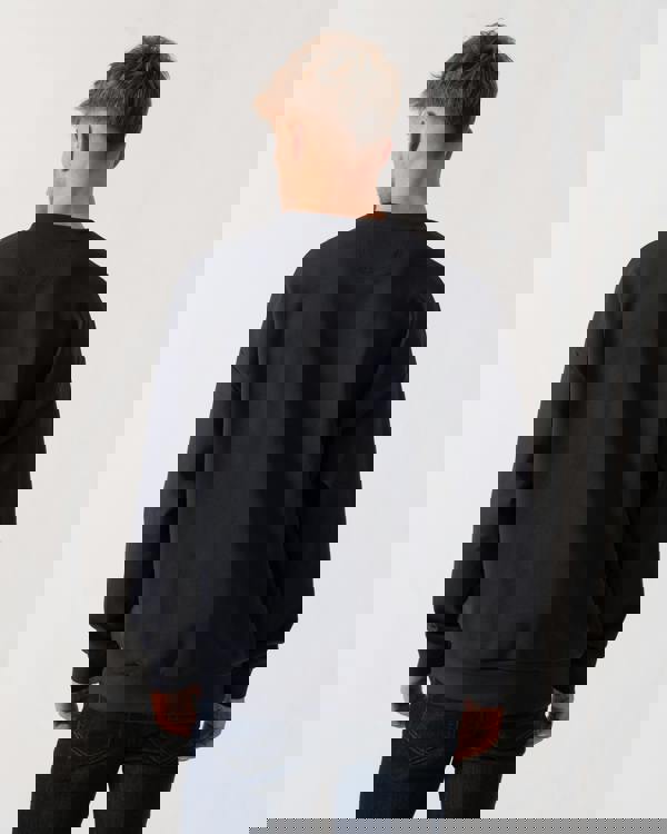 Model wearing BOSS Green Stenson Mens Crew Neck Sweatshirt in Dark Blue 403 - Back