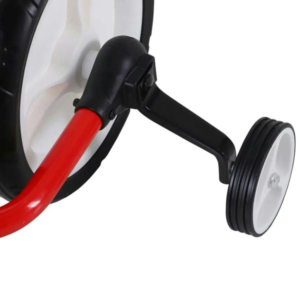 Auxiliary stabilizer wheel assembly on a red kids balance bike, with white rim