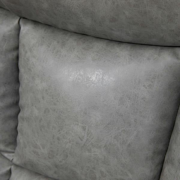 Close-up of light grey faux leather recliner upholstery with textured finish