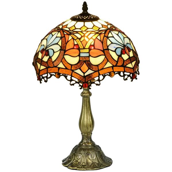 Stained glass table lamp with multicolored patterned shade and ornate brass base