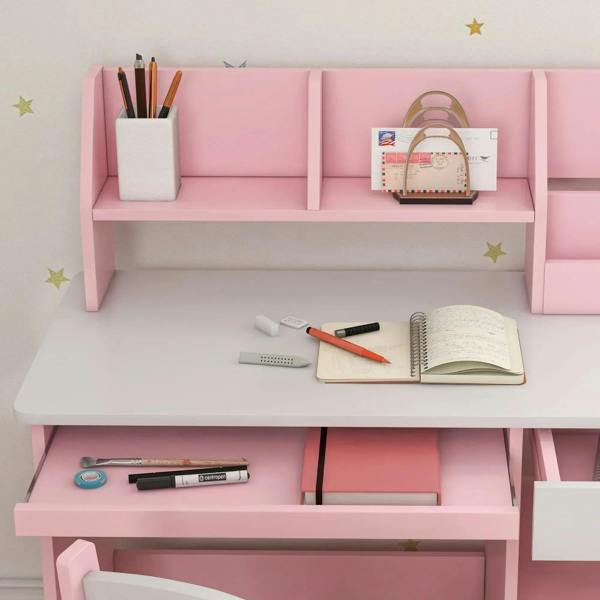 Pink kids desk with open compartments for pencils, books, notebook, and markers
