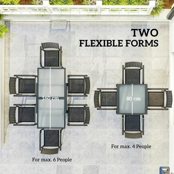 Outdoor dining layout with black extendable table and clear tempered glass top