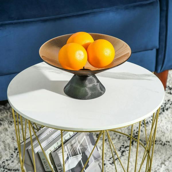 Round nesting side table with white top and gold wire frame, open storage below