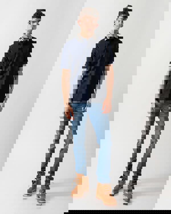 full length shot of a model wearing an Aquascutum Mens Club Check Collar Polo Shirt in Navy 11