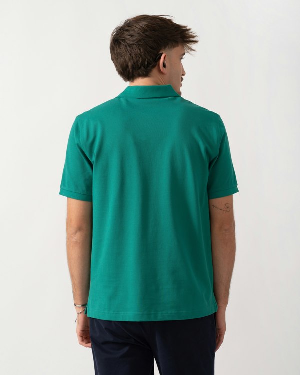 Back shot of a Model wearing a GANT Mens Regular Fit Short Sleeve Shield Logo Pique Polo in Botanical Hue