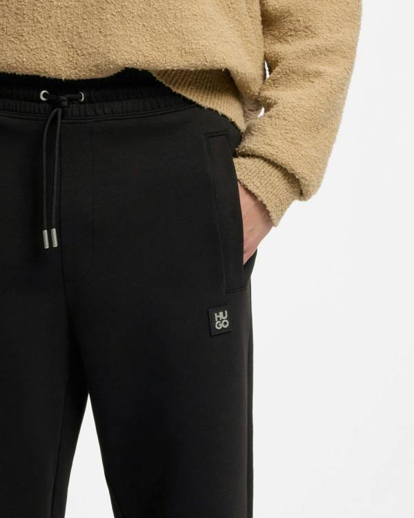 HUGO Dimacs Mens Cotton - blend tracksuit bottoms with stacked logo - Black 002 | CHO | Designer Mens,Trousers,Joggers