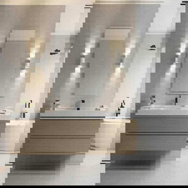 white contemporary sconce for bathroom mounted either side of a mirror in the bathroom 