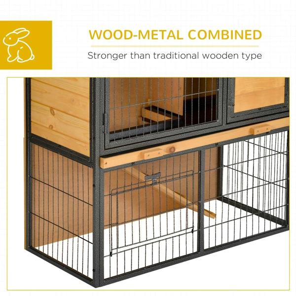 Side view of light yellow wooden rabbit hutch with black metal wire walls and front door.