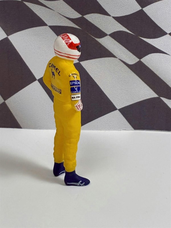 a toy figure of a man wearing a helmet
