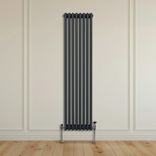 Traditional 3 column radiator in anthracite grey, 1800 x 382mm, featuring a sleek vertical design against a light wall and wooden floor