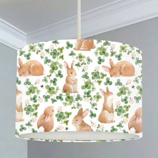 Children's bedroom and nursery lampshade, brown bunnies, and green leaves.