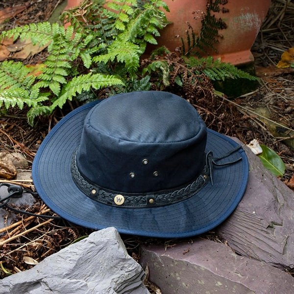 The wilderness navy waxed cotton unisex hat by Wombat
