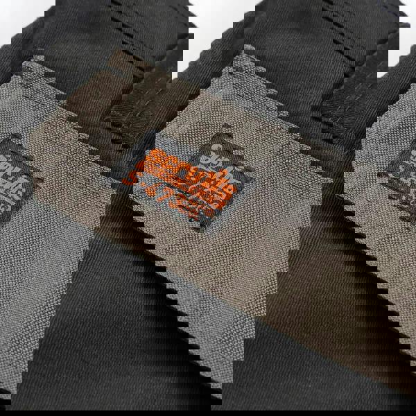 Scruffs Worker Plus Holster Mens Multi Pocket Cargo Shorts, close-up of the grey label on the black shorts showing the brand and product details.