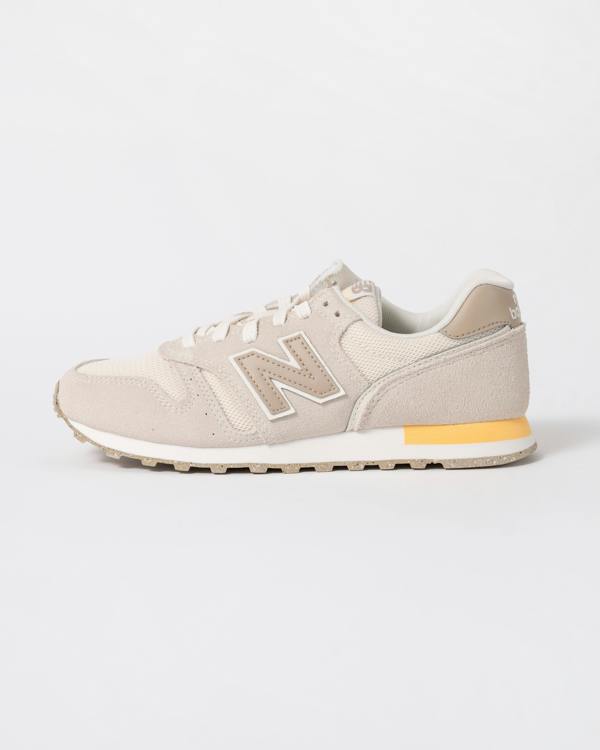 side of New Balance 373 Womens Trainers in Linen