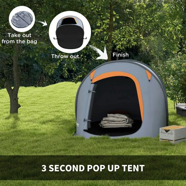 Grey and orange pop-up dome camping shelter with open door and stacked bedding inside