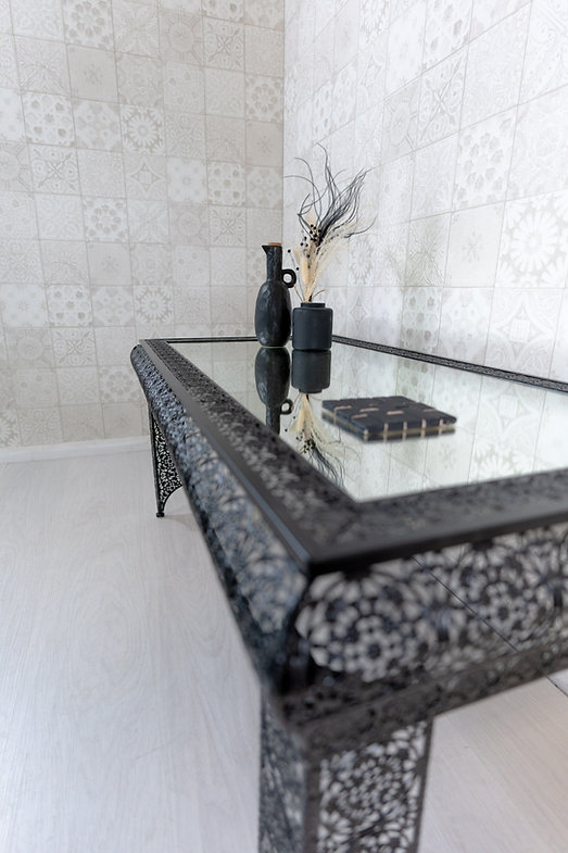 Downton Interiors Black Embossed Metal Mirrored Glass Coffee Table - Agadir Range