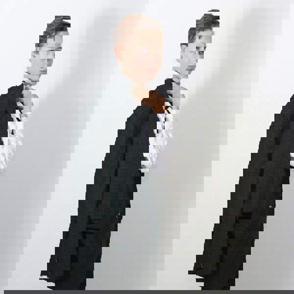 young boy holding jacket