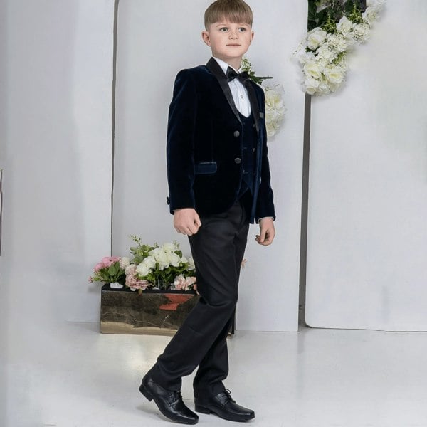 young model wearing his 5 piece navy tuxedo