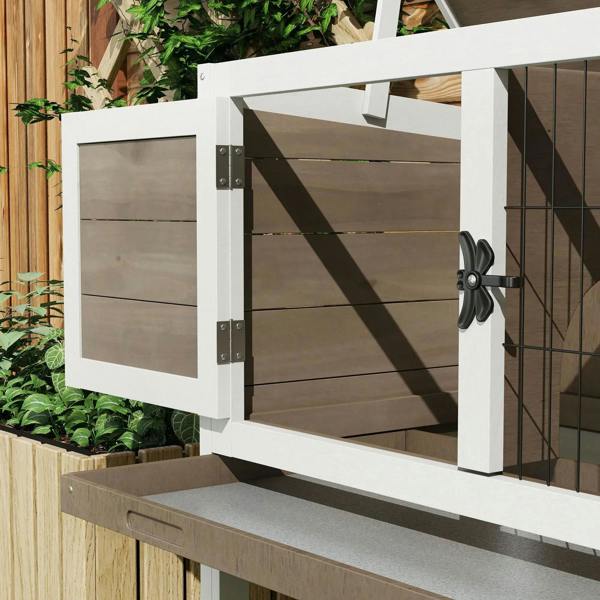 Brown wooden hutch with hinged front door and metal latch hardware