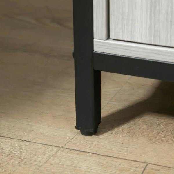 Black steel leg base of a light grey sideboard storage cabinet