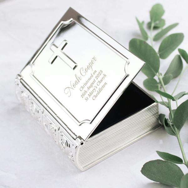 An open, personalised silver-finish Bible trinket box showing the dark fabric lining inside, engraved with a name and Christening details on the lid.