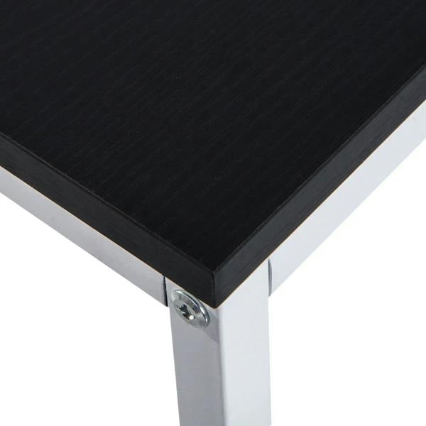 Black tabletop with corner metal bracket on white desk frame