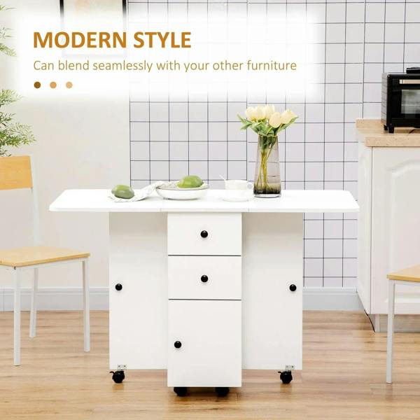 White drop-leaf dining table with multi-drawer cabinet base on casters.