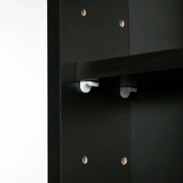 Black cabinet door hardware with concealed shelf tabs and white handle accents