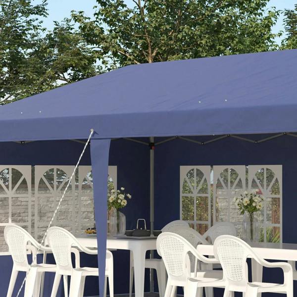 Blue pop-up gazebo tent with white window panels, front poles, and seating table setup