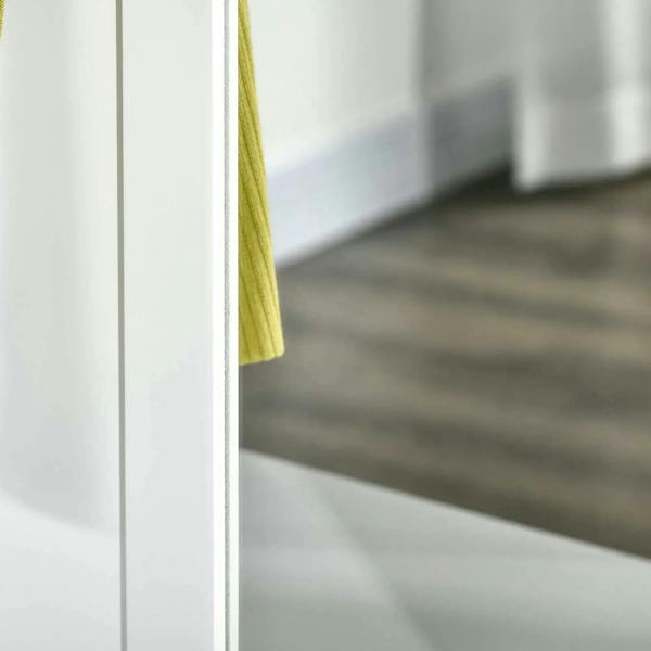 White cabinet shelf edge and interior cubby space for shoes